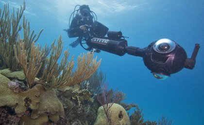 Researchers with the Catlin Seaview Survey are examining photographs to understand reef health. Credit: Catlin Seaview Survey. Researchers with the Catlin Seaview Survey are examining photographs to understand reef health. Credit: Catlin Seaview Survey.